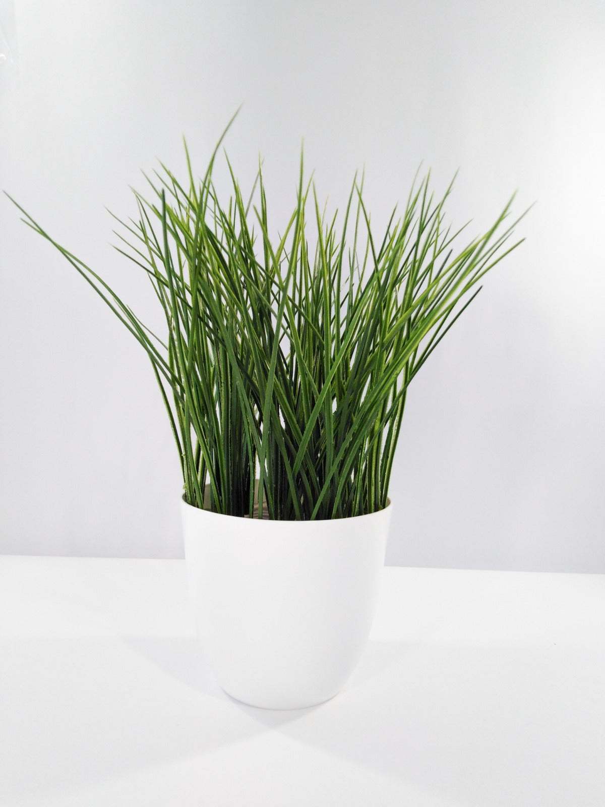 Artificial Grass Plant in White Pot