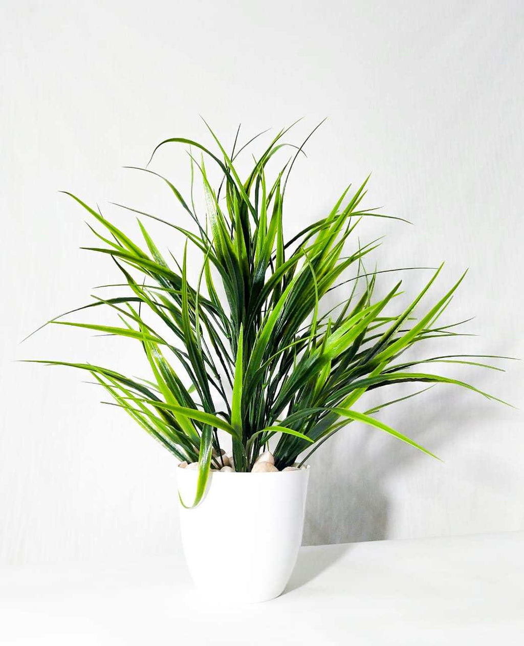 Artificial Spiky Grass Plant in White Pot with Pebbles