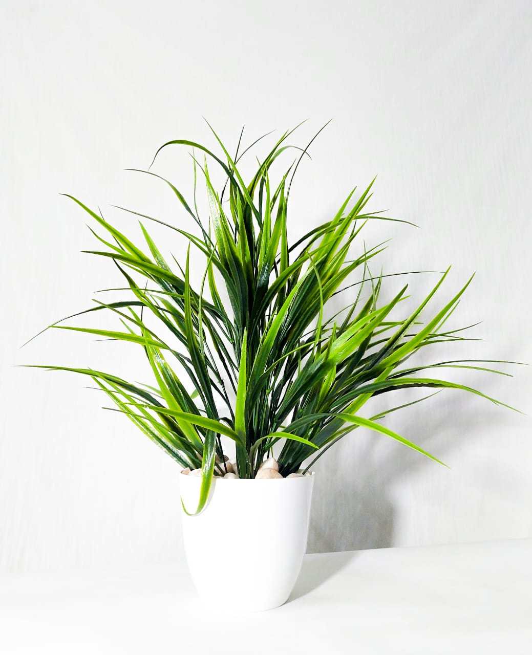 Artificial Spiky Grass Plant in White Pot with Pebbles
